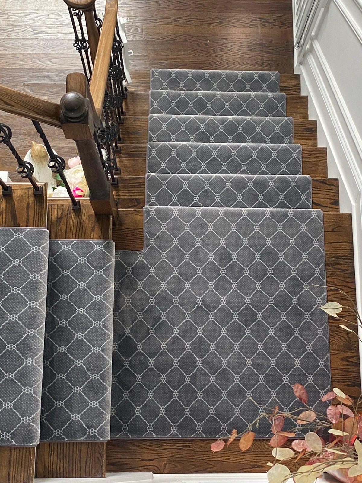 Modern gray geometric stair runner custom fitted around stairs and a landing